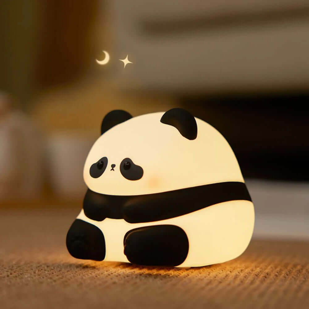 Cute panda night light lamp made of soft silicone, providing warm LED glow for kids' bedrooms and a delightful decor element.