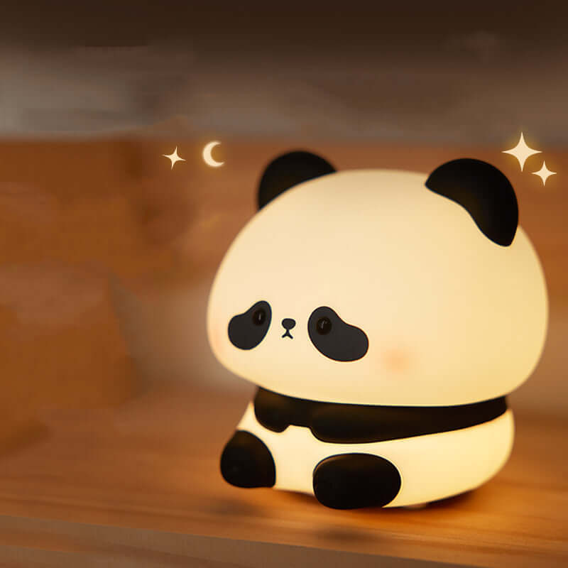 Cute panda night light for kids, made of soft silicone, providing adjustable warm white light for a cozy bedroom atmosphere.