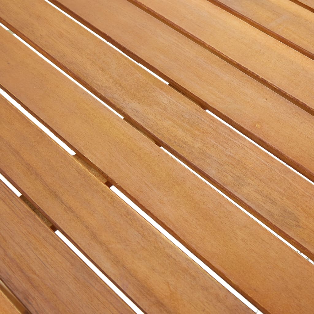 Close-up view of solid acacia wood surface of a garden table, showcasing its natural grains and oil finish.