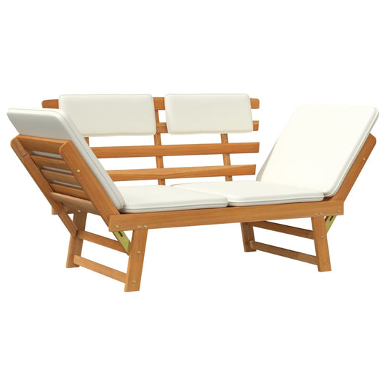 Garden bench with white cushions, convertible to sun lounger, made of solid acacia wood for outdoor relaxation.