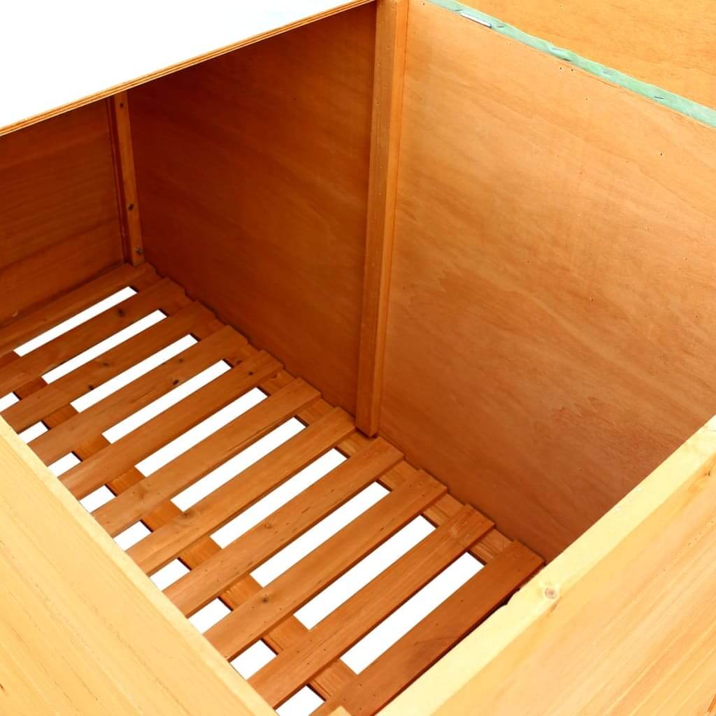 Inside view of wooden garden storage box, showcasing durable slatted base for effective moisture drainage and ventilation.