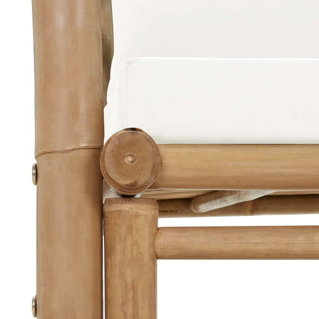 Close-up of bamboo garden chair construction with white cushion, showcasing durable and weather-resistant design.