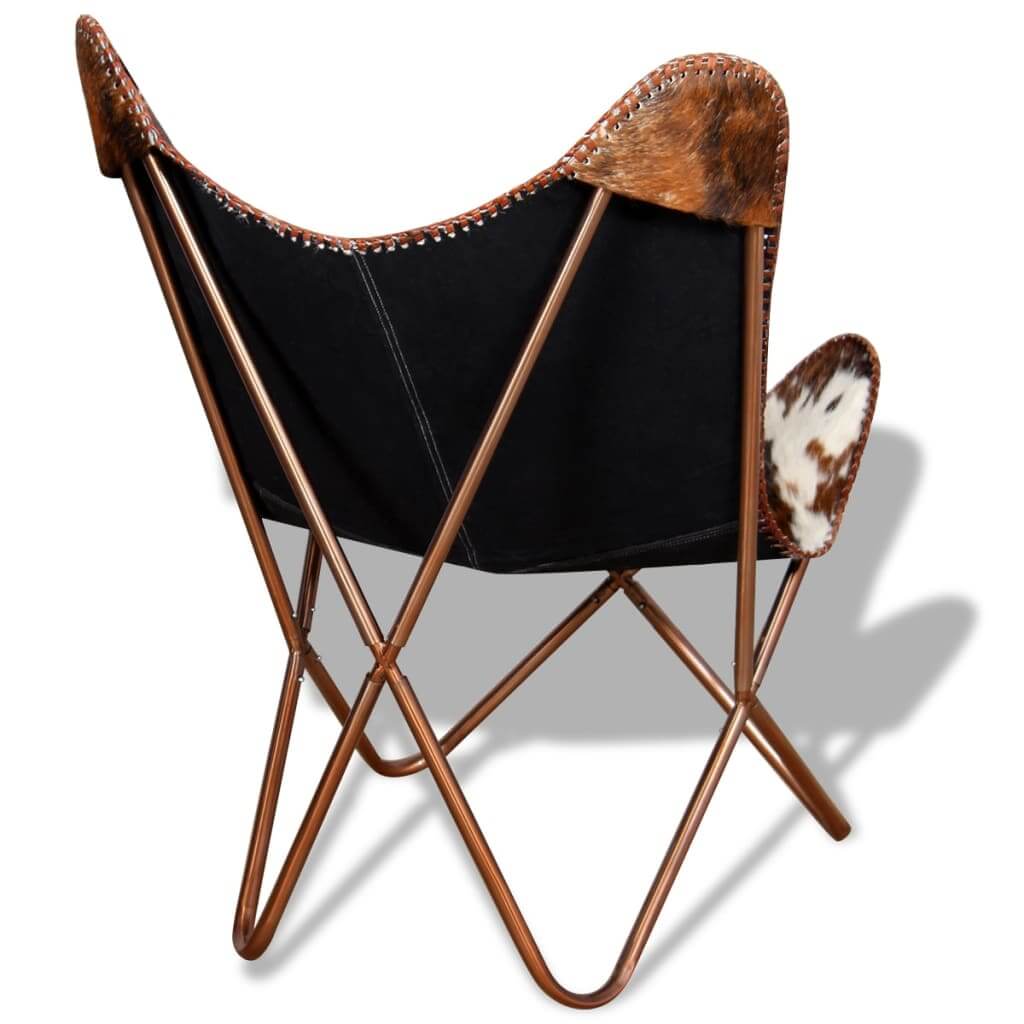 Vintage butterfly chair in brown and white cowhide leather with a metal frame, showcasing a stylish rear view.