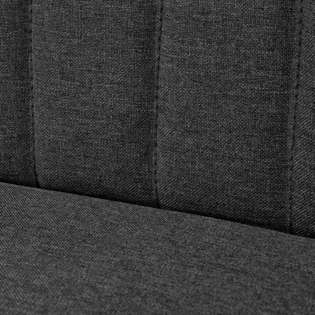 Close-up of dark grey fabric upholstery on a modern sofa, highlighting the texture and padded design for comfort.