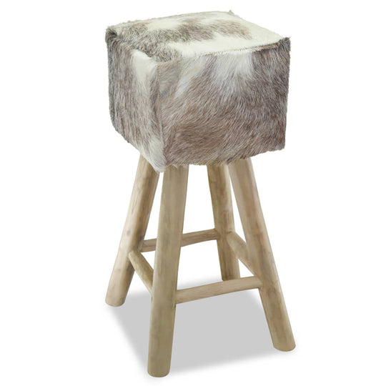 Stylish bar stool with goat leather upholstery and solid teak wood frame, perfect for rustic living spaces and outdoor furniture.