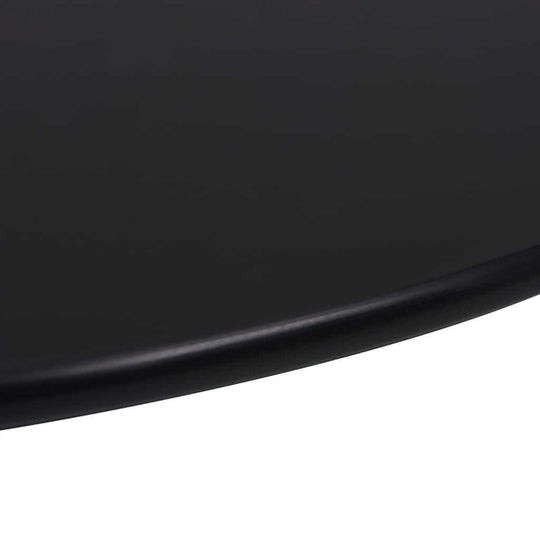 Close-up of a sleek black round table top, showcasing the smooth surface and modern design, ideal for dining and outdoor furniture.