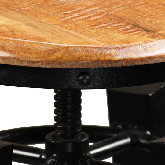 Close-up of height-adjustable bar stool showcasing solid mango wood top and metal frame for industrial-style decor.