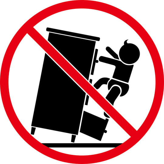 Warning sign against children climbing on furniture, featuring a toddler and a tall cabinet with a prohibition symbol.