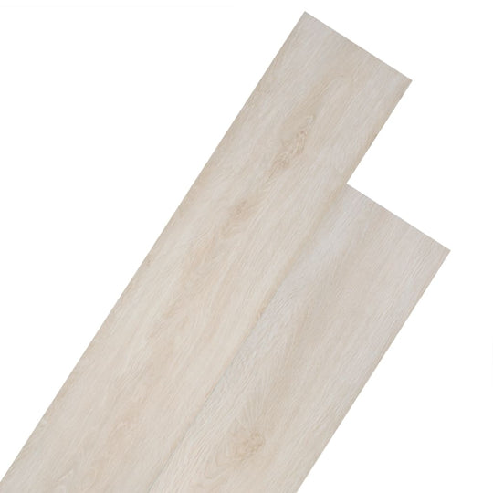 Self-adhesive PVC flooring planks in Oak Classic White, resembling natural wood with durable texture.