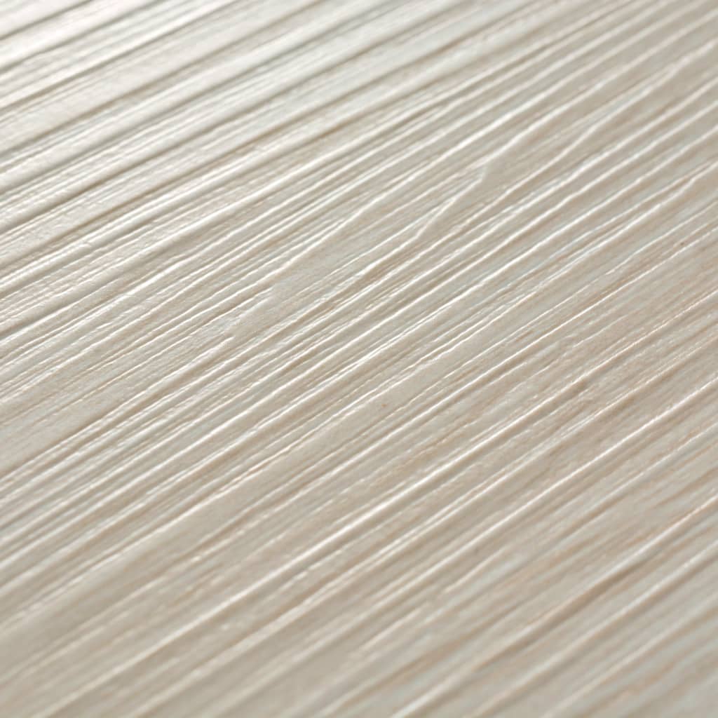 Close-up of oak classic white self-adhesive PVC flooring planks with textured wood grain pattern.