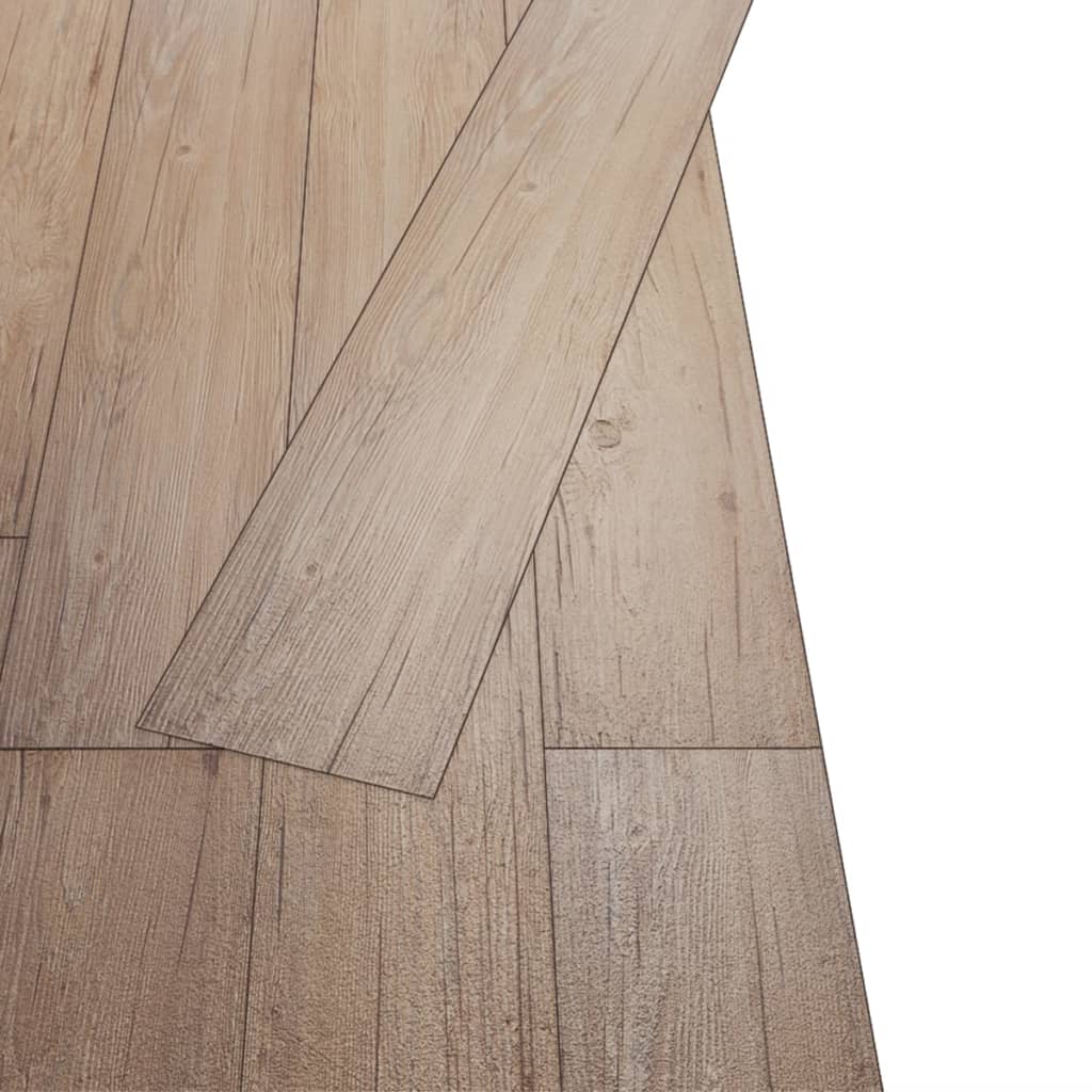 Self-adhesive PVC flooring planks in Oak Brown with realistic wood texture and patterns, showcasing easy installation.