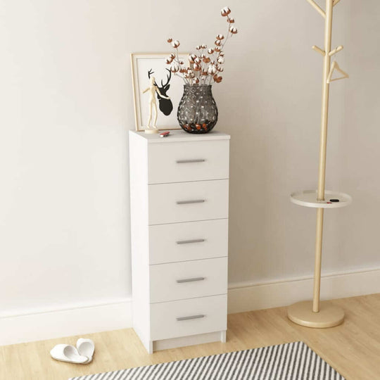 Tall white chest of drawers with five drawers, stylish decor, and a vase of flowers in a modern interior setting.