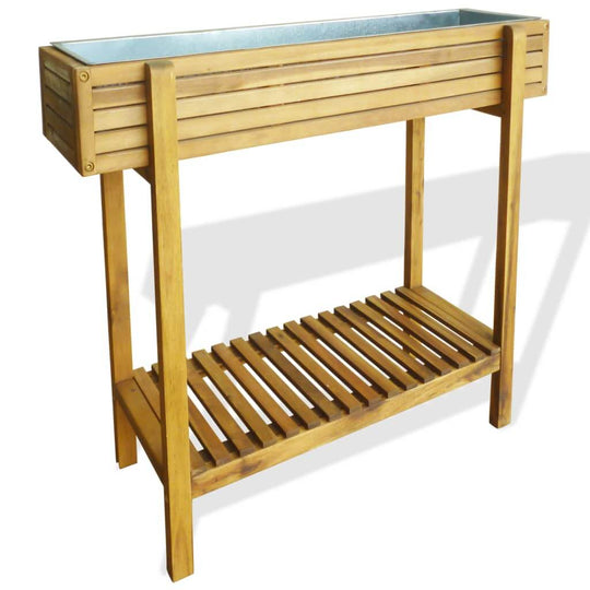 Raised garden bed made of solid acacia wood with a zinc liner, featuring a rustic design and lower slatted shelf.