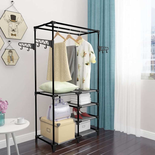 Minimalistic black clothes rack with non-woven fabric shelves, ideal for bedroom or bathroom organization.