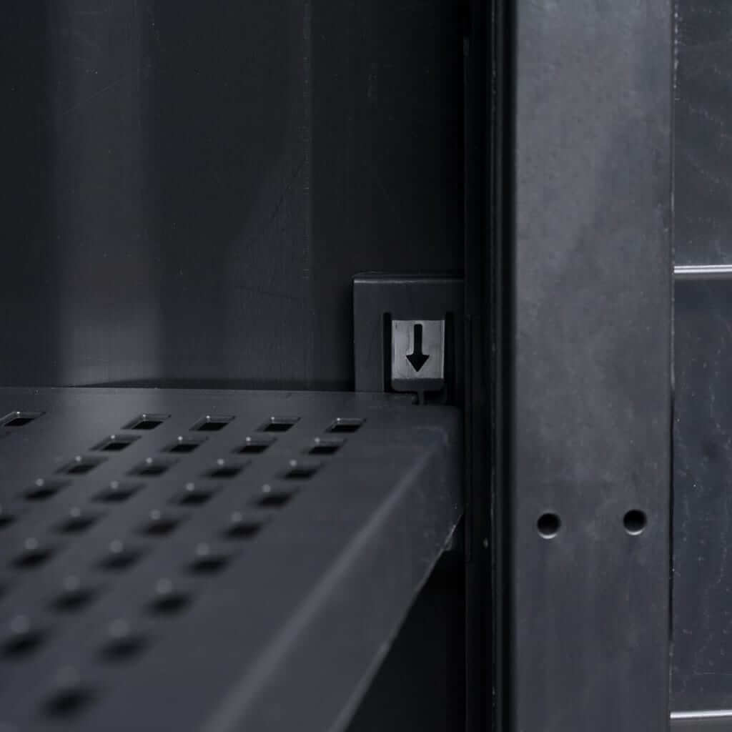 Close-up of adjustable ventilated shelf in black garden storage cabinet for efficient organization.