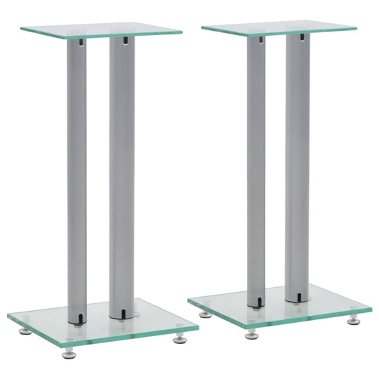 Silver speaker stands with tempered glass tops and sturdy pillars, designed for stability and vibration reduction.