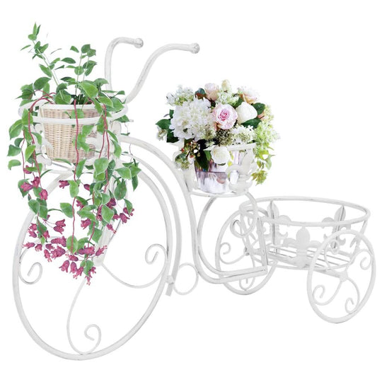 Vintage-style metal bicycle plant stand with flowers, antique white, perfect for home and garden decor, patio furniture piece.