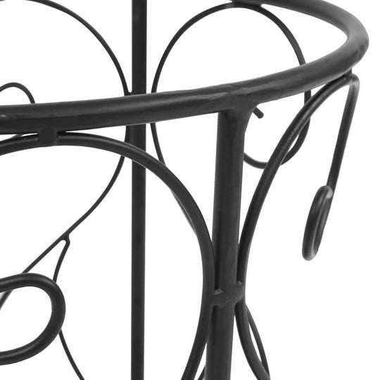Vintage style metal umbrella stand close-up showcasing ornate scrollwork details, perfect for home decor and furniture.