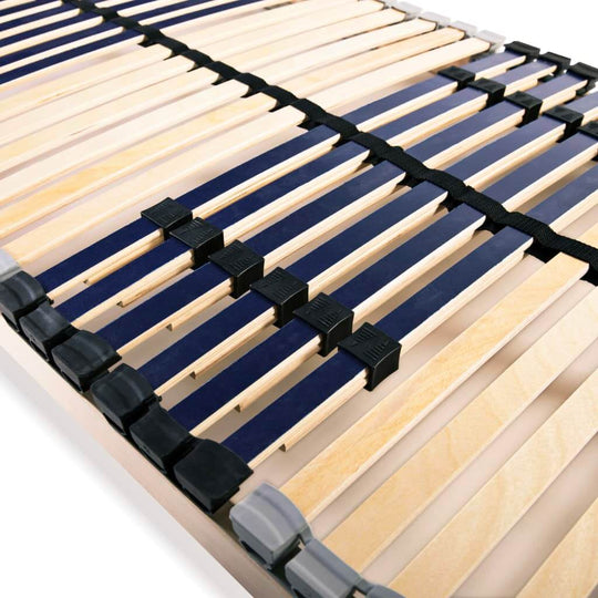 Slatted bed base close-up showing beechwood slats and SBS rubber caps for enhanced stability and comfort zones.