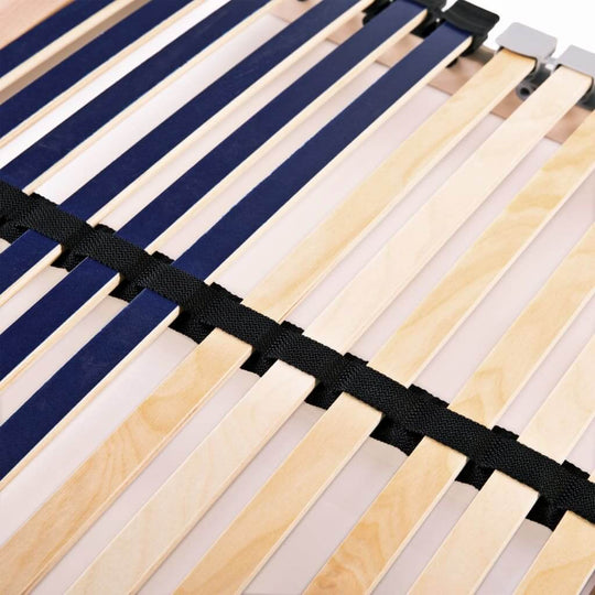 close-up of slatted bed base showing beechwood slats and rubber caps for stability, part of a 90x200 cm bed frame.