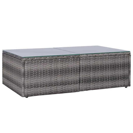 Grey poly rattan coffee table with glass top for outdoor lounge furniture. Ideal for garden or patio settings.