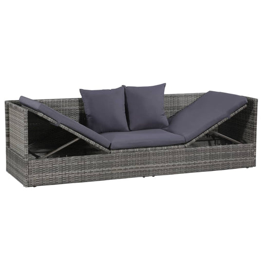 Grey poly rattan garden bed with adjustable lounge positions and plush cushions, perfect for patio relaxation.