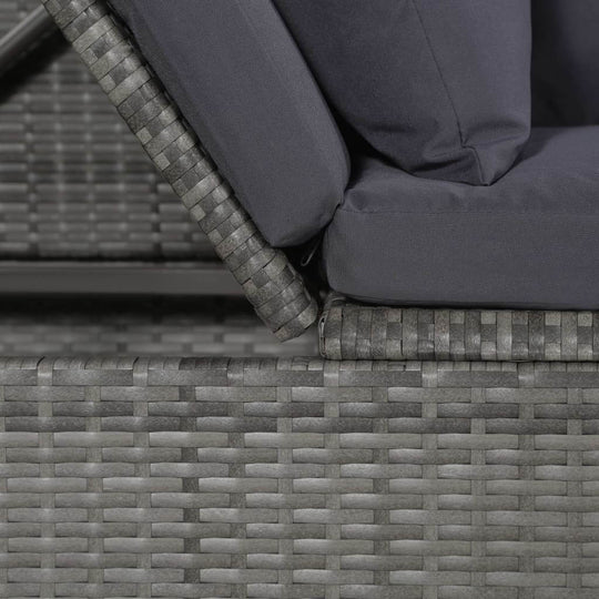 Close-up of poly rattan garden bed with adjustable backrest and cushioned seat in grey color.