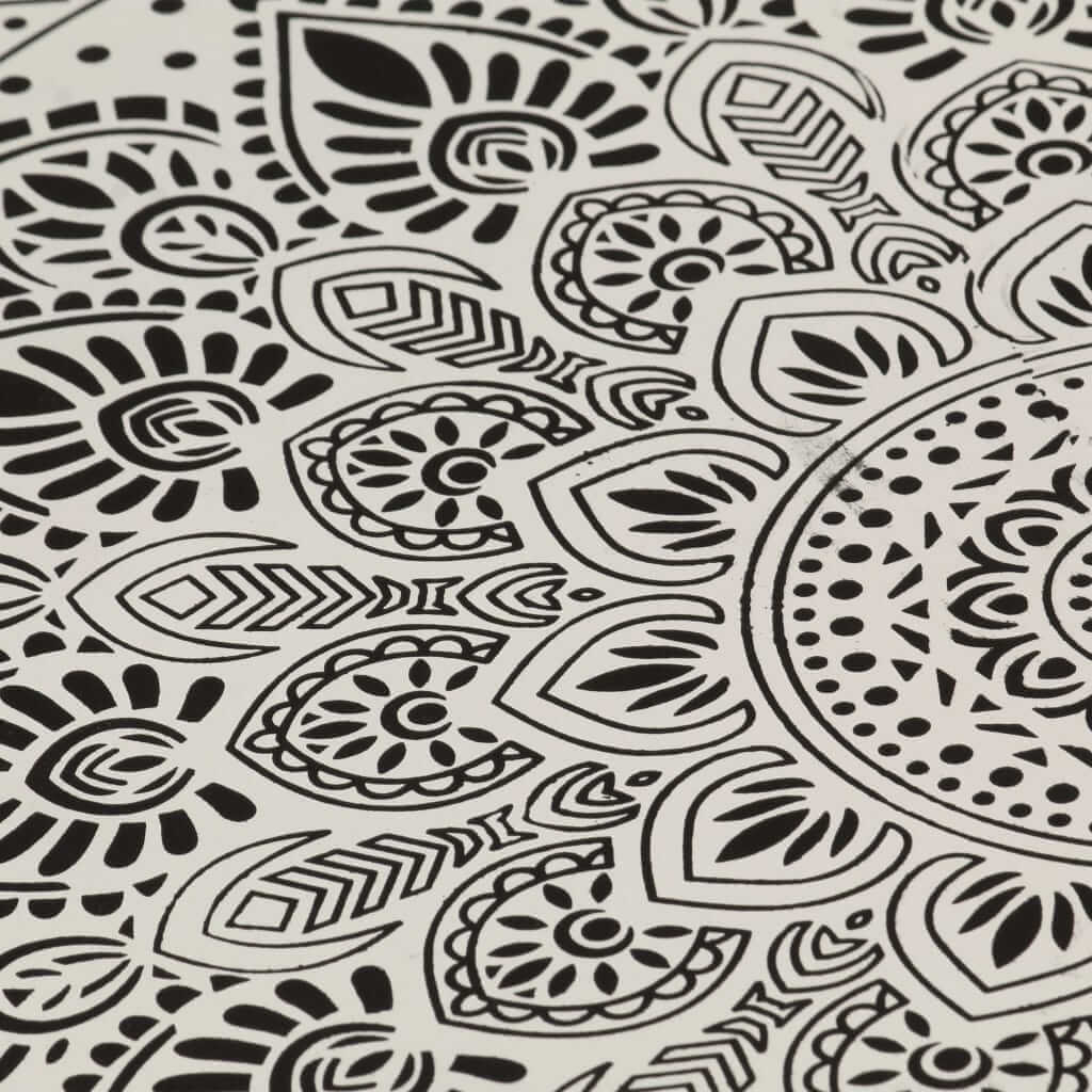 intricate black and white mandala pattern design on a smooth surface, ideal for home decor or artistic projects.