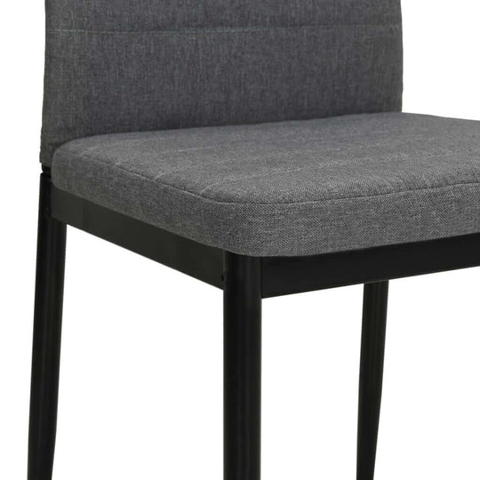 Light grey upholstered dining chair with a sturdy steel frame, perfect for outdoor or home furniture settings.