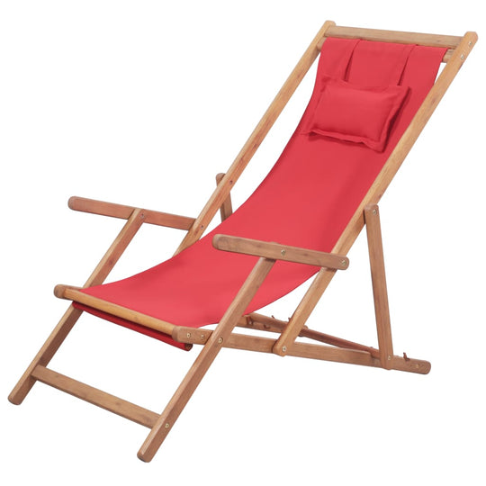 Folding beach chair with red fabric and wooden frame, adjustable reclining settings for comfort.