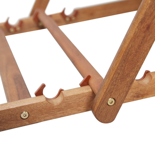Close-up of a sturdy wooden frame for a folding beach chair with precision joints and brass fittings.