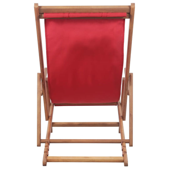 Comfortable folding beach chair with a red fabric seat and sturdy wooden frame, ideal for outdoor relaxation.