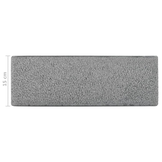 Rectangular gray riverstone sink 45x30x15 cm, showcasing a rustic texture for stylish bathroom decor.