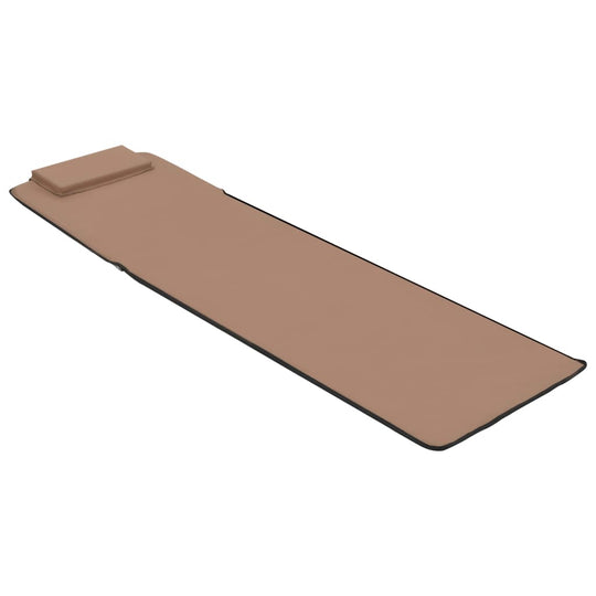 Folding beach mat with adjustable backrest and built-in headrest in tan fabric, perfect for outdoor relaxation.