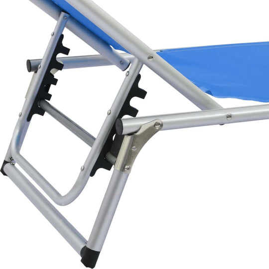 Close-up of the adjustable framework on a folding sun lounger with an aluminium frame and blue textilene fabric.