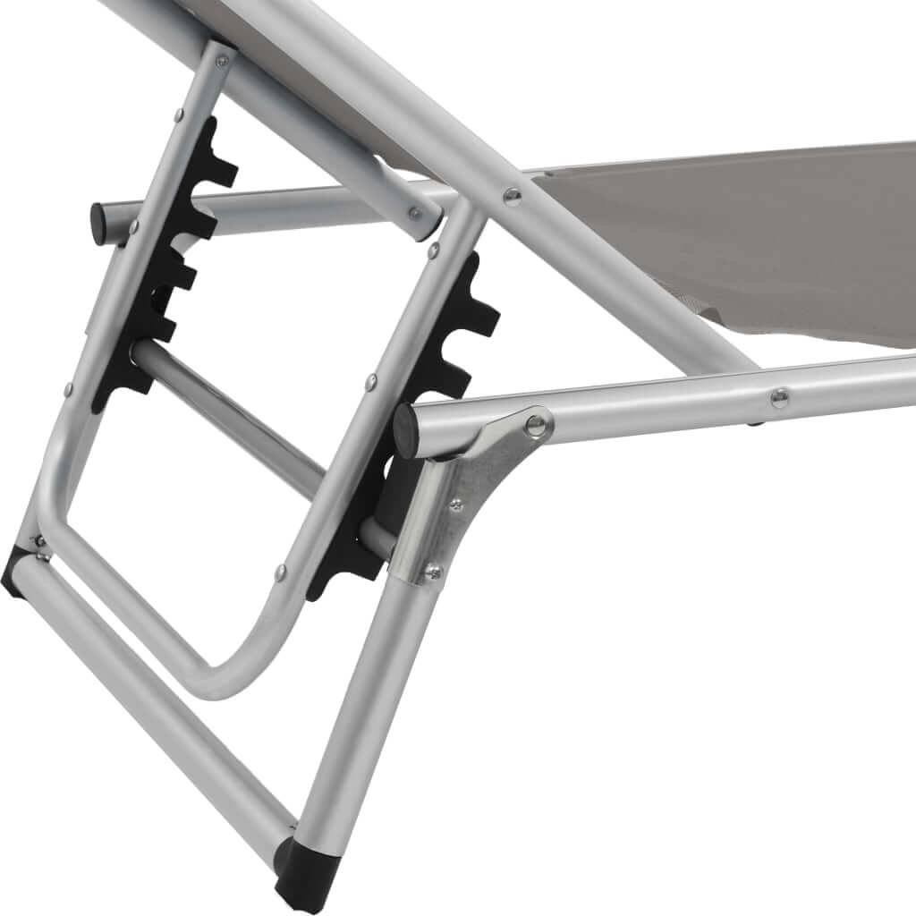 Close-up of the adjustable frame and folding mechanism of a sun lounger with aluminium construction.