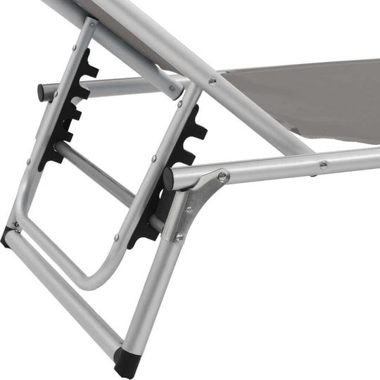 Close-up of the adjustable frame and folding mechanism of a sun lounger with aluminium construction.
