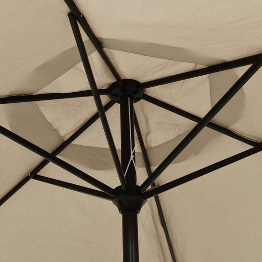 Underneath view of the taupe outdoor parasol showing metal pole and sturdy support structure for sun protection.