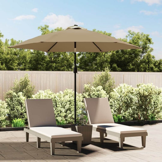 Outdoor parasol in taupe shade providing UV protection over lounge chairs in a sunny garden setting. Ideal for outdoor furniture.