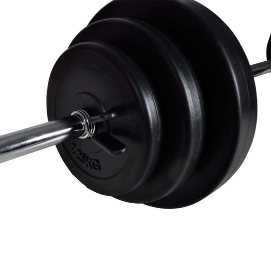 Close-up of a barbell with weight plates, showcasing a 125 kg capacity for strength training workouts.