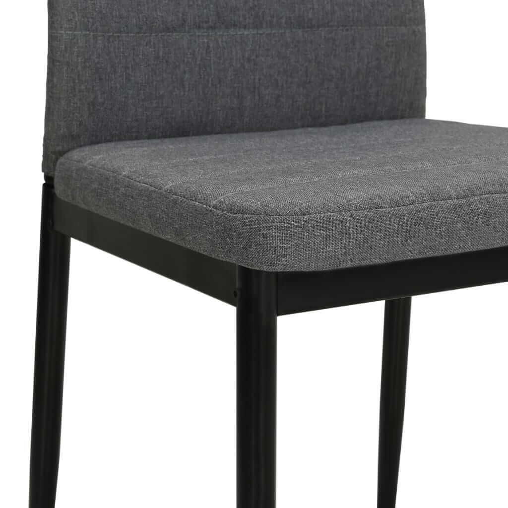 Light grey fabric dining chair with sturdy steel frame, perfect for outdoor and indoor living spaces.