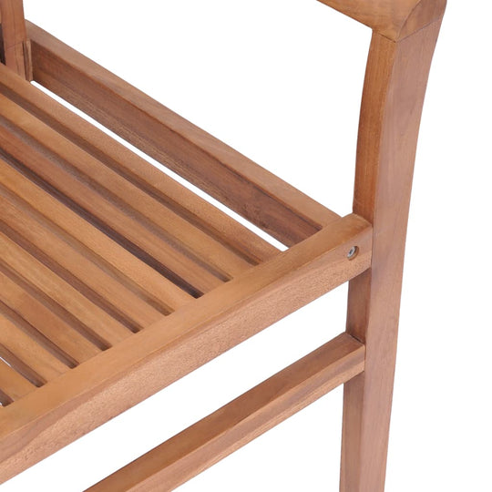 Close-up of slatted solid teak stacking dining chair, showcasing durable wooden design for outdoor and patio furniture.