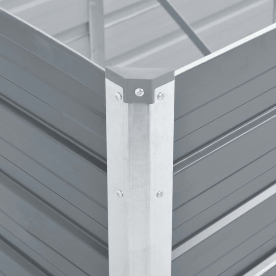 Close-up of galvanised steel corner joint in a grey garden raised bed, showcasing durability and stability for outdoor furniture.