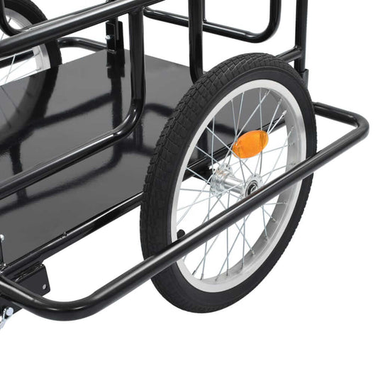 Close-up of a black metal bike trailer wheel with heavy-duty construction, designed for transporting furniture, luggage, or outdoor items.