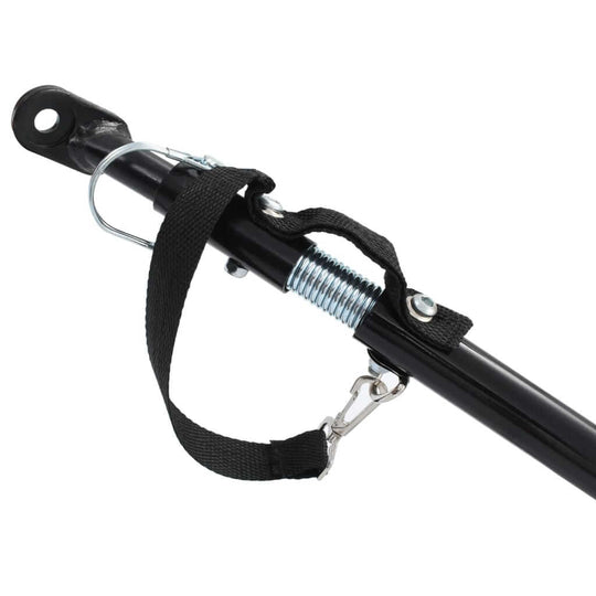 Close-up of bike trailer hitch attachment with spring mechanism and strap for secure connection. Ideal for outdoor transport.