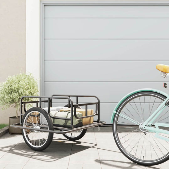 Bike trailer with cargo ready for outdoor use, featuring heavy-duty steel construction and easy attachment to bicycles.