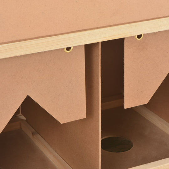 Interior view of a wooden chicken laying nest with three compartments and removable bottom for easy cleaning.