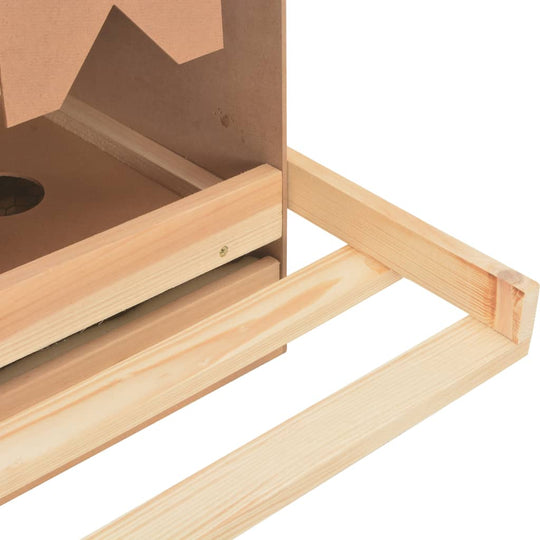 Close-up of chicken laying nest with removable bottom layer and wooden structure for easy cleaning and egg collection.