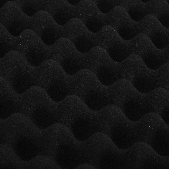 Close-up of black shock-resistant foam with a wavy texture, ideal for gun case interior cushioning and protection.