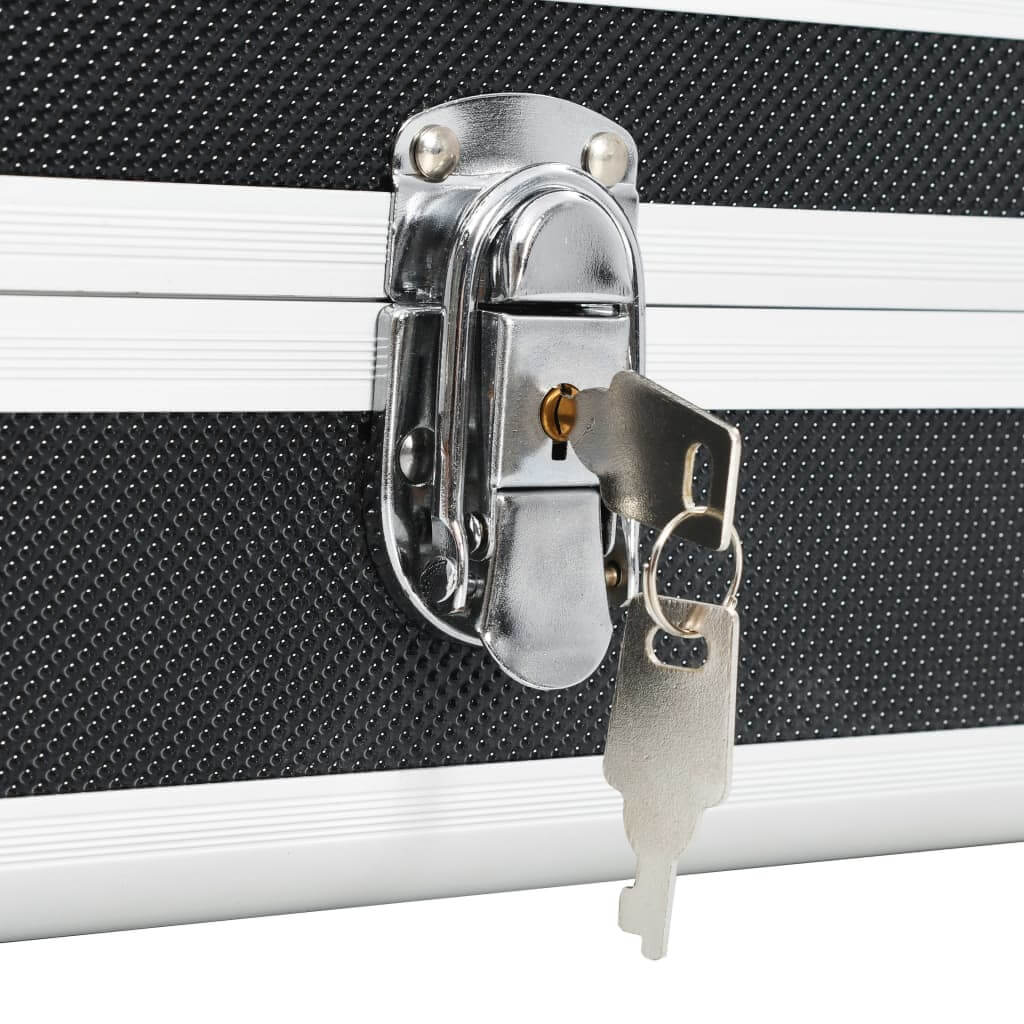 Close-up of a secure lock and key on a durable black gun case made of aluminium and ABS material.